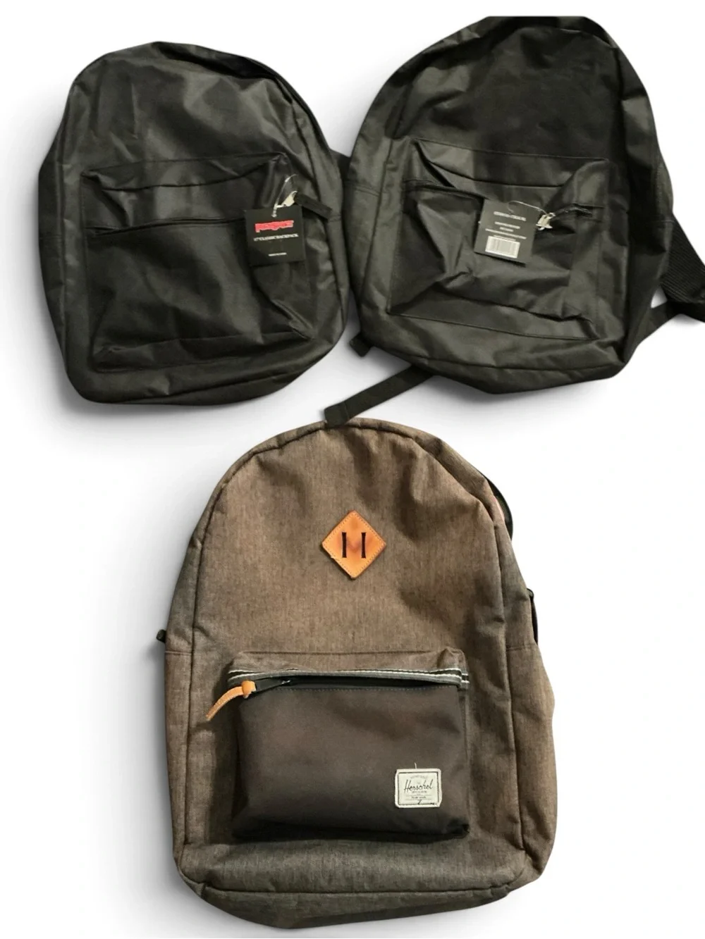 Bundle of 1 Brown Canvas Backpack like new and 2 new black backpacks